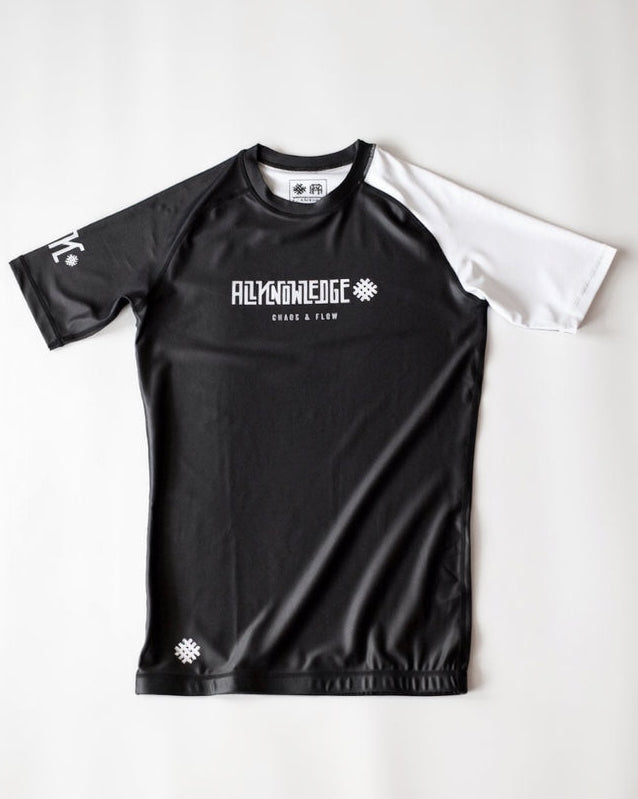 Black athletic shirt with white text on a light gray background